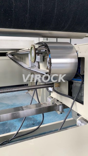 Textile stenter machine processing fabric